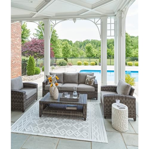 Signature Design by Ashley Oasis Court Outdoor Sofa Chair Table Set 4-Piece with Cushions and Pillows Grey