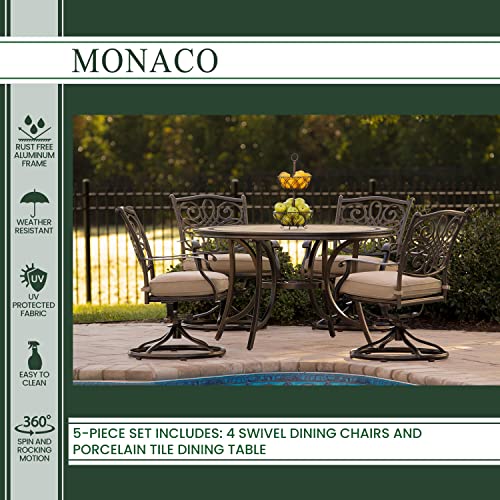 Hanover Monaco 5-Piece Outdoor Patio Dining Set with 4 Cushioned Swivel Rocker Chairs and 51" Round Tile-Top Table, Brushed Bronze Finish Tan
